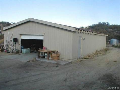 WORKSHOP-GARAGE, AS YOU ENTER FROM DRIVEWAY ONTO THE HOMESITE PA