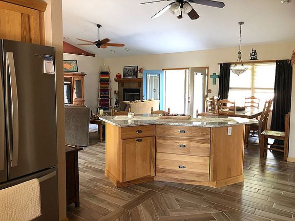 Standing in kitchen area.