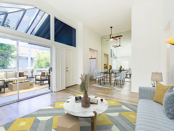 Dining space with vaulted ceilings and natural light