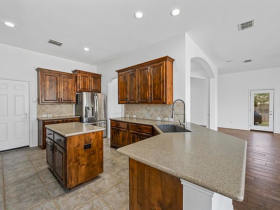 Kitchen open to nook and living area