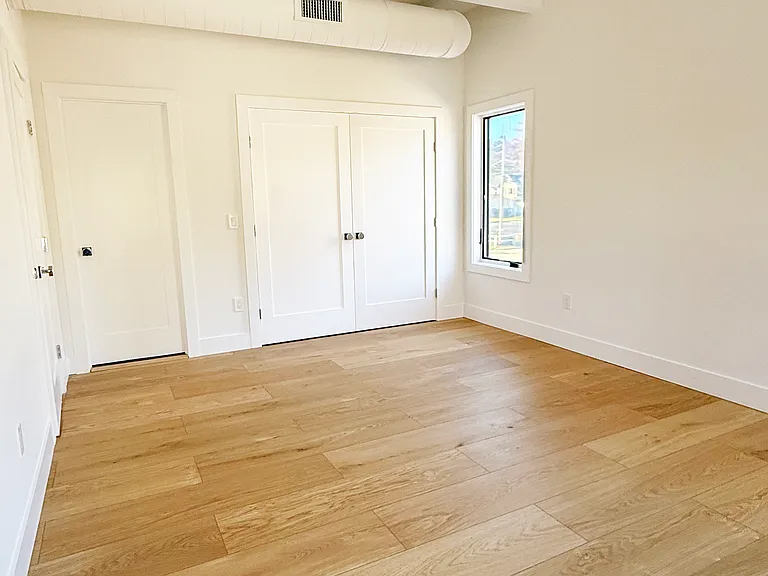 Primary bedroom with ensuite bath and built-in double closet