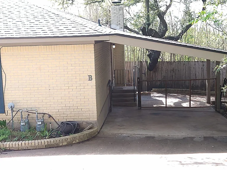 Covered attached private carport.