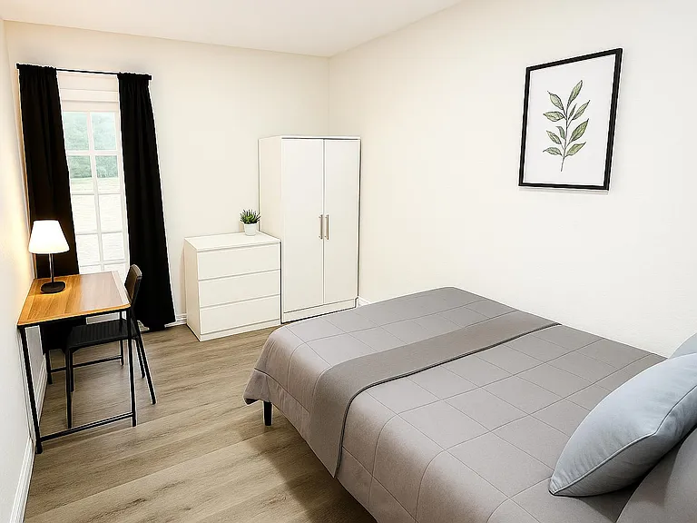 Cozy, well-lit room with private entry, work desk, and full furnishings. Easy access to amenities and on-site parking.