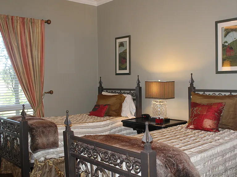 Second bedroom has large window.