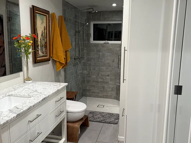 Primary Bedrooms 3/4 Ensuite. Mirrored walk-in closet door