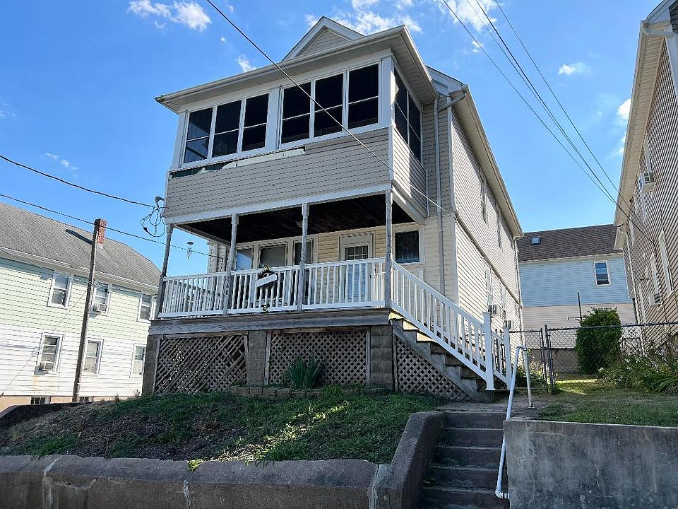 Located on corner property, second floor apartment w/ finished attic with heat and separate office, storage room and den