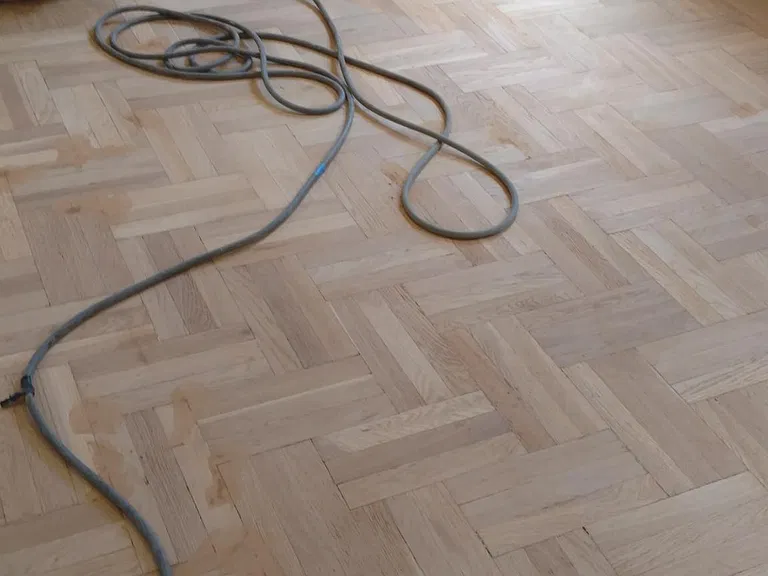 Like new sanded and two coats polyurethane. Original parkay inlaid floors