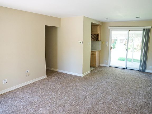 Living room, dining area, kitchen and back door. Hallway to
