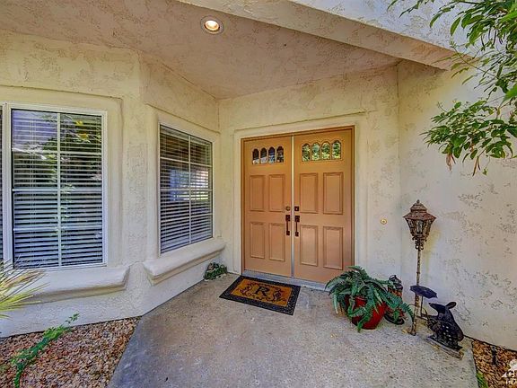 Double doors with fountain in the background.