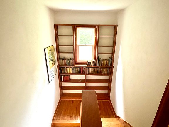 Upstairs hallway with bookshelf
