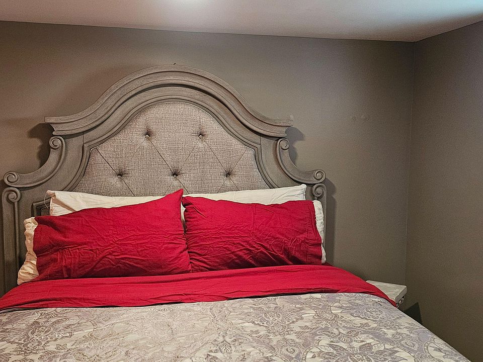 Queen bed with shared bathroom