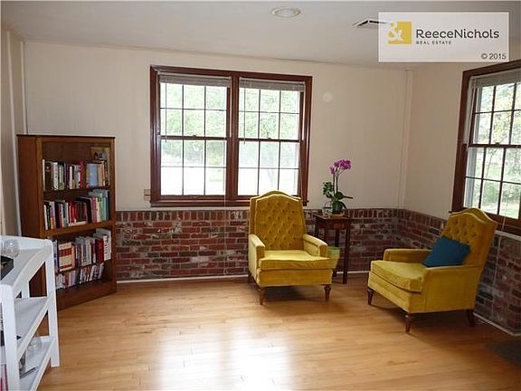 Sun room has wonderful light, hardwood floor and is open to family room and kitchen.