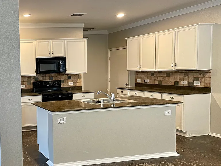 Kitchen, granite, tumbled backsplash, stained concrete
