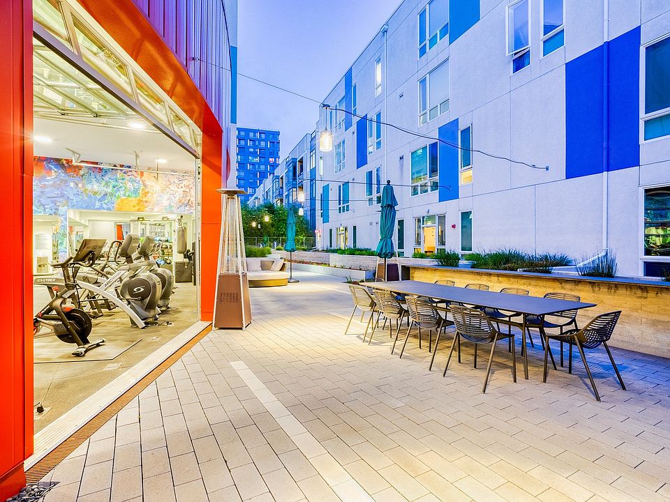 The fitness center garage doors open up to the courtyard for fresh air