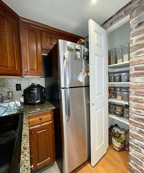 Spacious kitchen pantry, deep with inbuilt shelves
