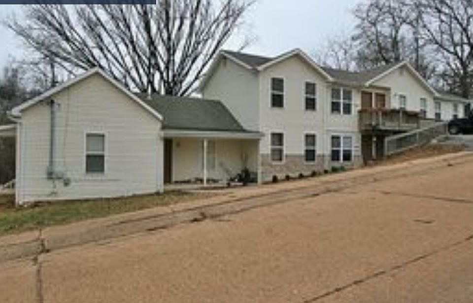 Upper unit top right side. Second door from the right.