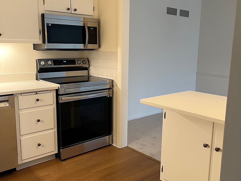 Kitchen includes all appliances, a disposal, and a lot of storage. Quartz counters.