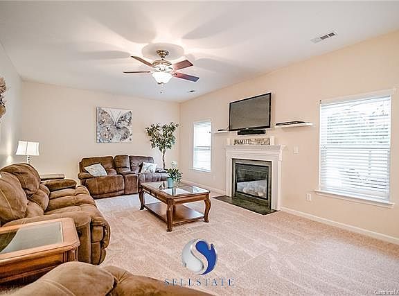 Spacious living room with gas fire place provides enough room for a crowd. Plenty of space for furniture of all kinds!