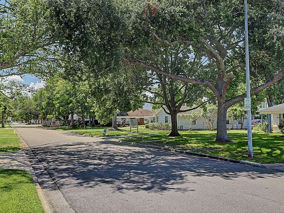 Beautiful tree-lined street that has many newly built homes.