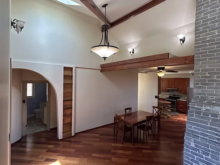 View of dining area and hallway bath.