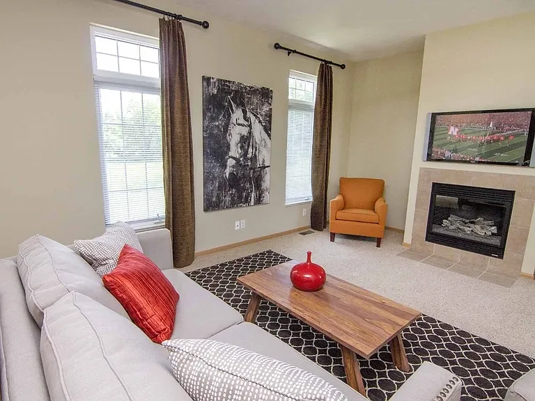 Our spacious living rooms are perfect for relaxing by the cozy fireplace, creating a warm and inviting space for everyday living.