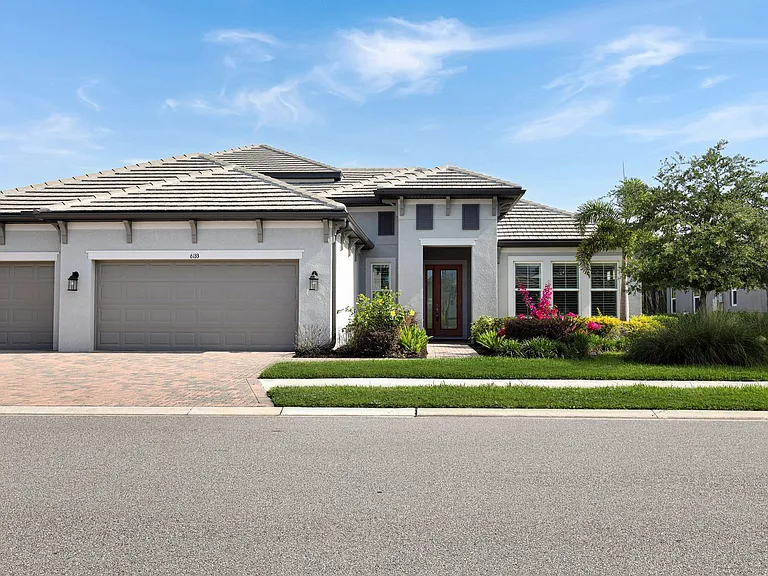 6133 Lungo Lago Dr — Photo 3