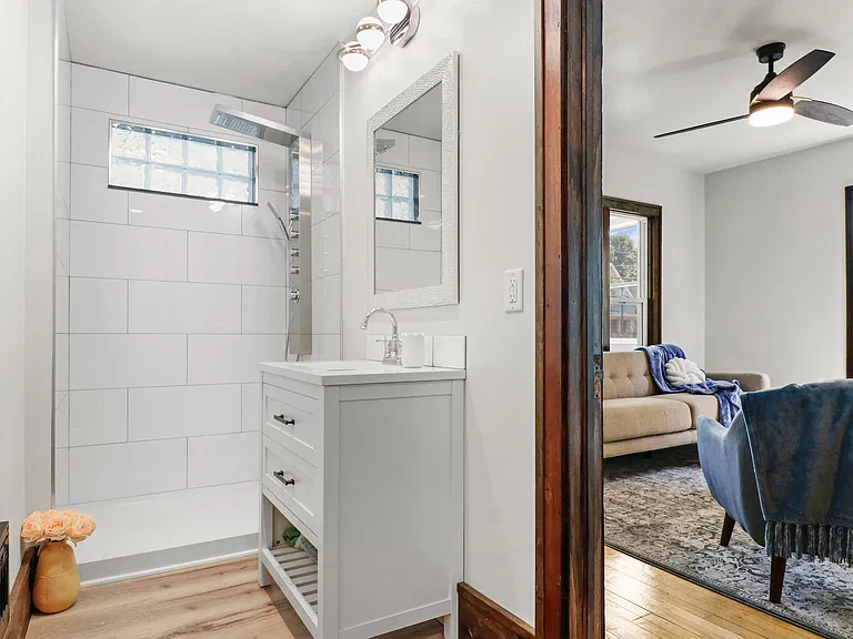 Now you can see it all! CHECK out the shower panel and beautiful mirrow and vanity. Front bathroom downstairs unit.