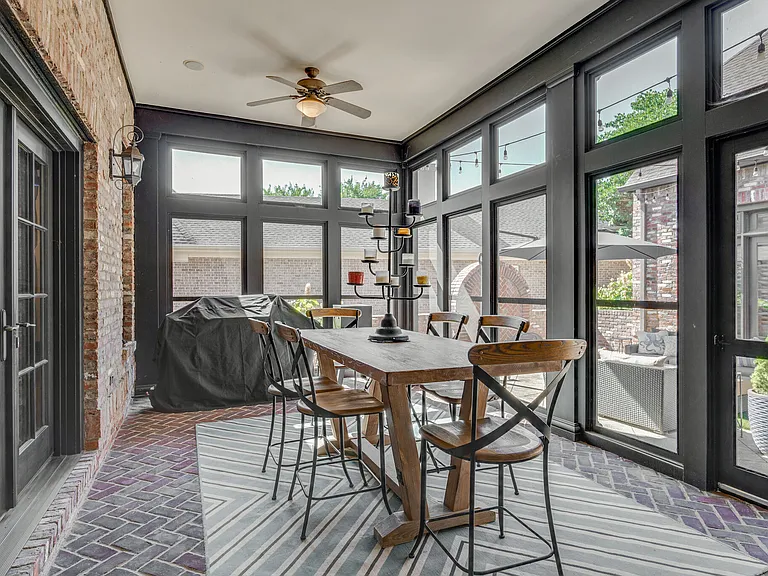 screened porch with natural gas grill. Access from Kitchen and french doors from music room. Screen door access to courtyard.