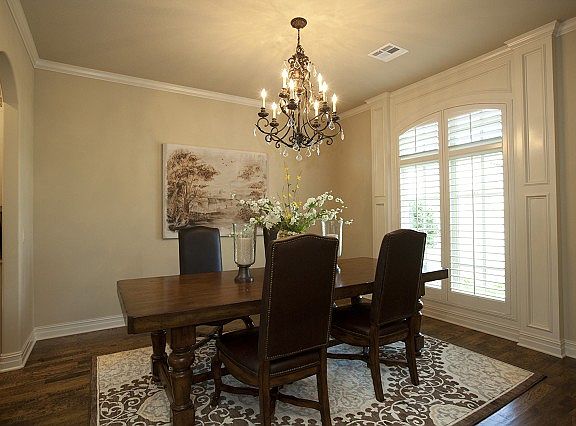 Formal dining withhardwood floors.