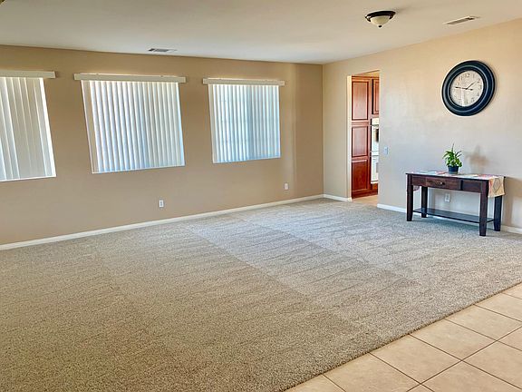 Entry way opens to dining/ formal living area.