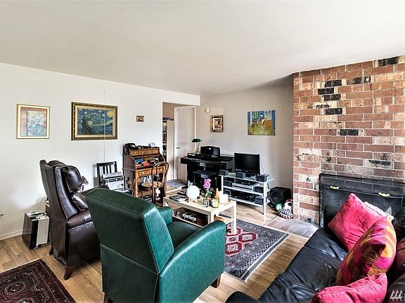 Welcome home as you walk into living room and brick fireplace!