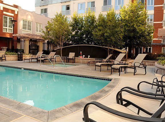 complex features courtyard with pool, spa