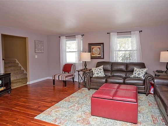Just off the entry is the beautiful Acacia hardwood flooring leading through the living room and dining room.