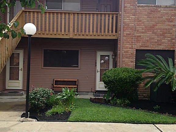 Updated stairwell leads you to the front door on the top right.