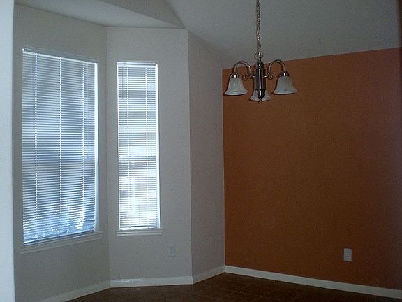 Formal dining room has a beautiful bay window.