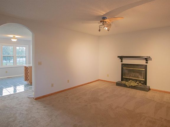 Living room with wood burning fireplace