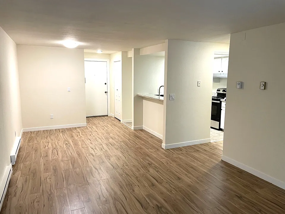 View of entry with guest closet on a side and dining area