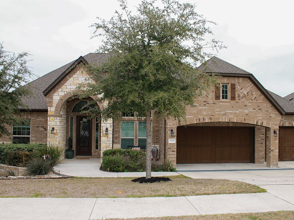 Front porch & 3-car garage