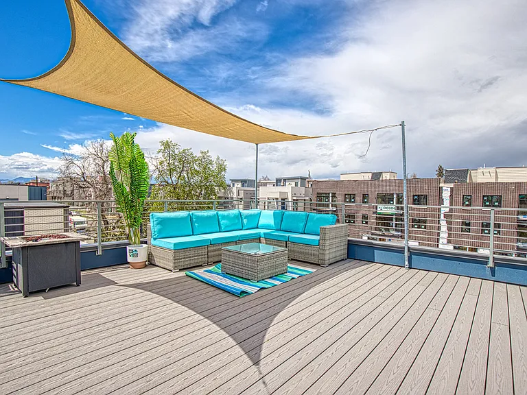 Rooftop with views of the mountains and downtown
