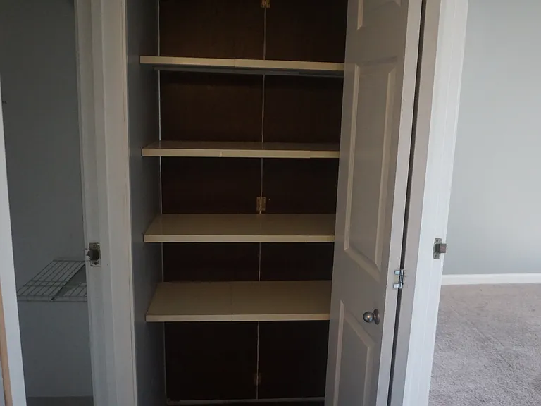 A pass-through linen closet adds even more storage.