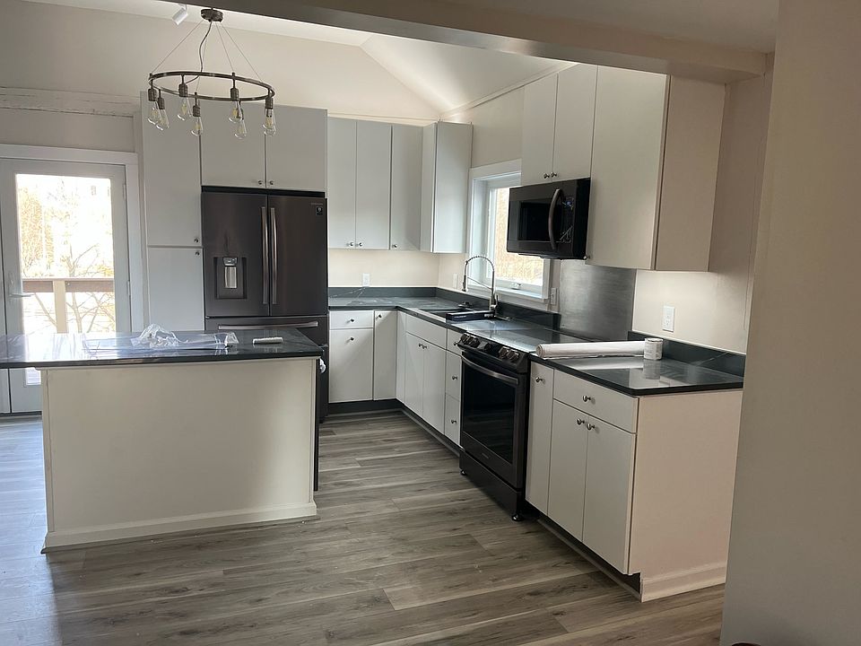 view of kitchen from top of stairs