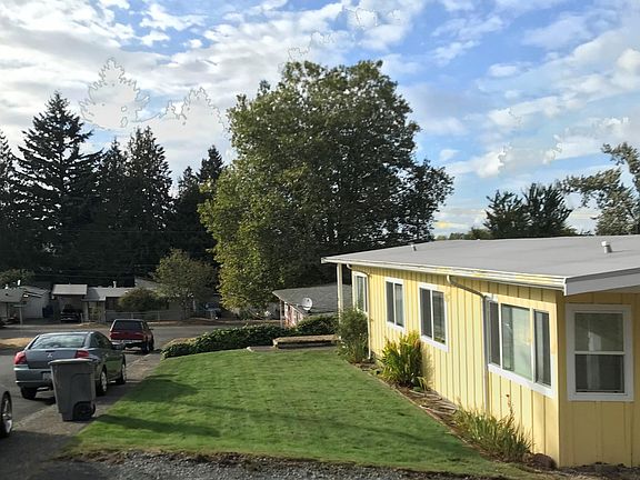 Looking west across the front of the property, available unit closest on right.