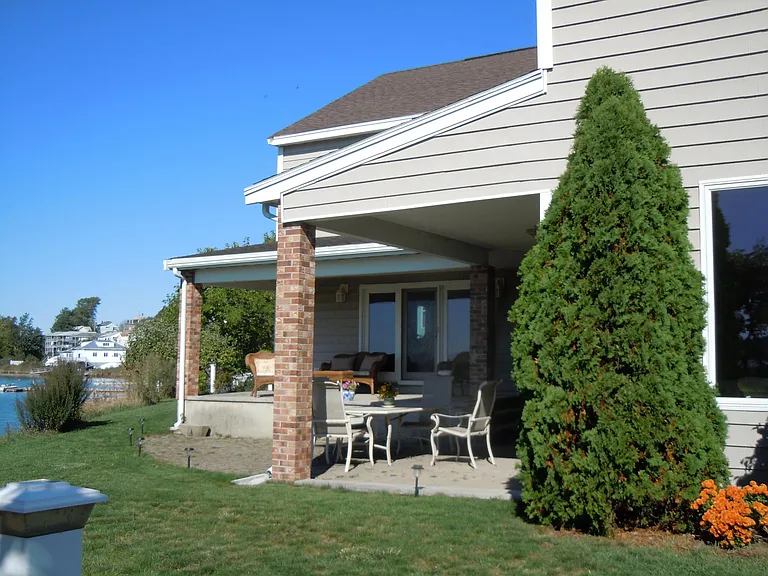 bi-level patio with outdoor dining and sitting areas -patio faces south