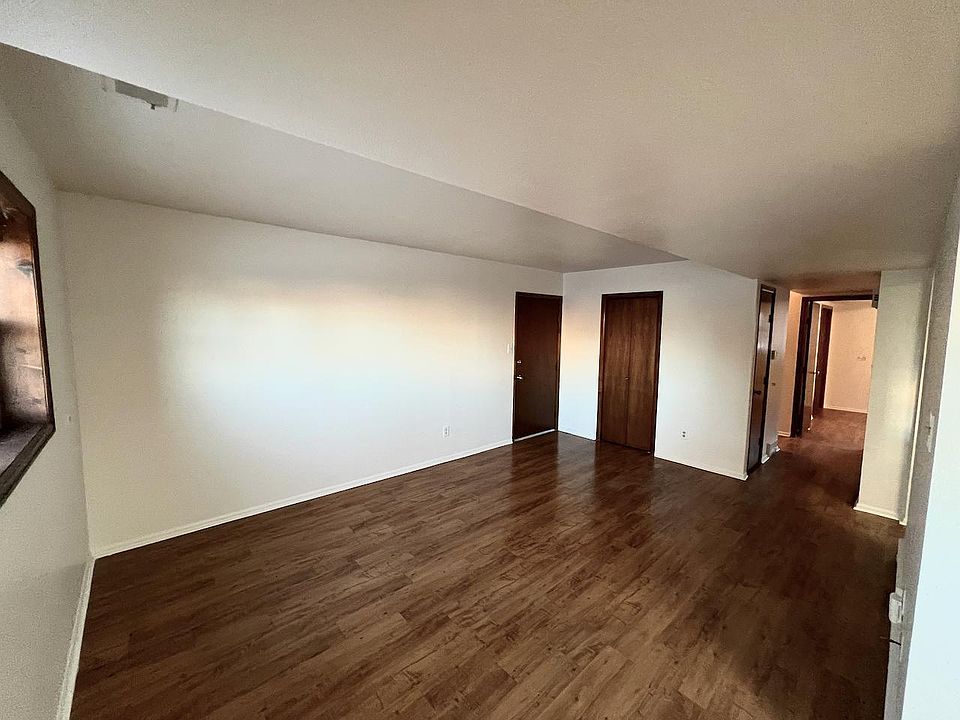 Living room, kitchen is on the right. Coat closet and entry door.
