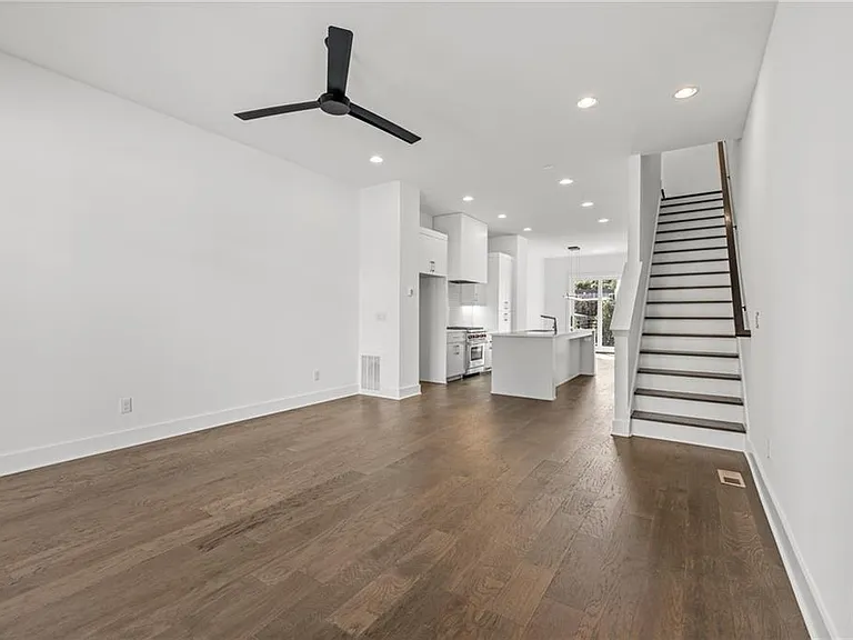 Living Room (Note: Actual unit has light wooden floors and upgraded fixtures / appliances)