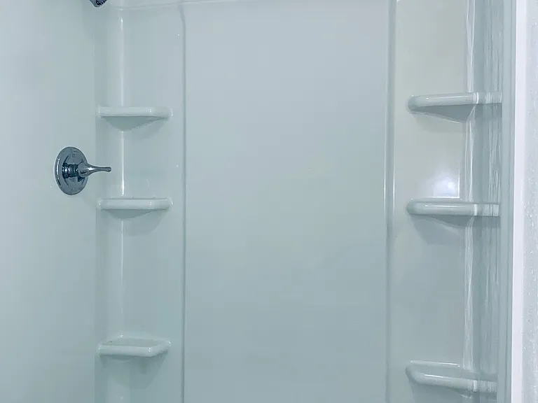 Standin shower with glass doors in second bedroom