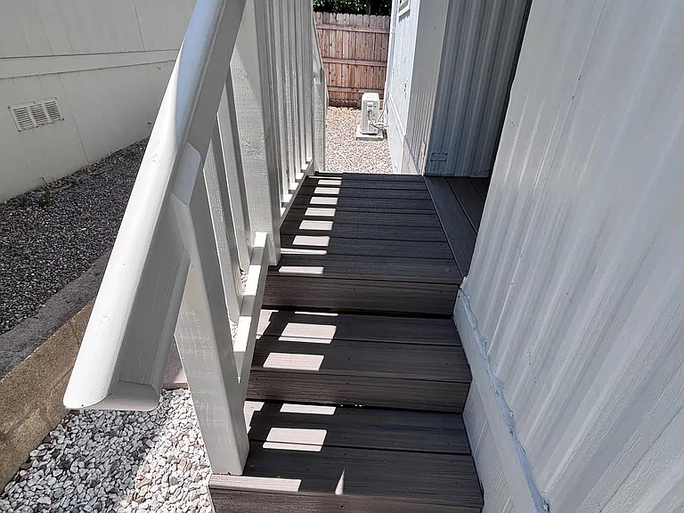 This bright, well-maintained mobilehome offers a crafted staricase that adds both style and saftey.