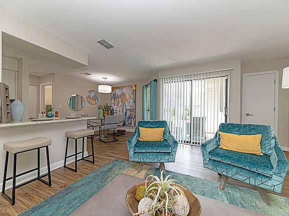 Spacious living room with hardwood-style flooring