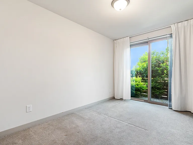 2nd bedroom with with sliding glass doors and private patio on bottom level.