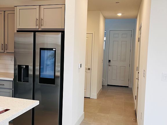 Entry way + partial Kitchen